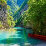 Albania, the newest popular destination, Ksamil, Sarande, Dhermi, Gjirokaster, Kruja, Shale River, Shala River Canyon, Komani Lake, Shala river boat ride, shall river canyon boat ride, Komani Dam, Komani Lake ferry stop, Shala islands, Shala River Albania, Valbona-Shala National Park, Theth to Shala River, Shala River boat tour, Shala River attractions, Shala River camping, Shala River waterfalls, Shala River hiking, Shala River photography, Valbona Valley, Albanian Alps, Shala River scenic views, Best time to visit Shala River, Shala River accommodation, shala river hike, shala river canyon hike,shala river canyon tours, shala river canyon swimming, shala river hotel, how to get to shala river,  Albanija, najnovije popularno odredište, Ksamil, Sarande, Dhermi, Gjirokaster, Kruja, rijeka Shale, rijeka Shala, kanjon rijeke Shala, jezero Komani, vožnja brodom po rijeci Shala, vožnja brodom po kanjonu rijeke Shall, brana Komani, trajektna stanica na jezeru Komani, otoci Shala, Shala Rijeka Albanija, Nacionalni park Valbona-Shala, Theth do rijeke Shala, obilazak brodom rijeke Shala, atrakcije rijeke Shala, kampiranje na rijeci Shala, slapovi rijeke Shala, planinarenje rijekom Shala, fotografija rijeke Shala, dolina Valbona, Albanske Alpe, slikoviti pogledi rijeke Shala, Najbolje vrijeme za posjetiti rijeku Shala, smještaj na rijeci Shala, planinarenje rijekom Shala, planinarenje kanjonom rijeke Shala, obilasci kanjona rijeke Shala, plivanje u kanjonu rijeke Shala, hotel na rijeci Shala, kako doći do rijeke Shala, popularna odredišta, ​