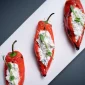 Speca me gjize, albanska kuhinja, albanska jela, tradicionalna albanska hrana, punjene paprike, paprika sa sirom, albanski recepti, gjize sir, balkanska kuhinja, jela iz Albanije, tradicionalni recepti, pečene paprike, Speca me gjize, Albanian cuisine, Albanian food, traditional Albanian dishes, stuffed peppers, peppers with cheese, Albanian recipes, gjize cheese, Balkan cuisine, food from Albania, traditional recipes, roasted peppers,